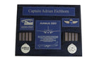 Black pilot retirement plaque with blue accents