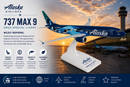 Model of an Alaska Airlines 737 MAX 9 airplane with sunset background