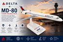 Delta MD-80 model airplane with sunset airport background