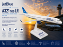 Model of a JetBlue A321neo LR airplane with sunset and airport background