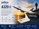 Model of a JetBlue A320 airplane with sunset at an airport in the background