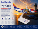 Southwest Airlines model airplane with Missouri One livery at an airport terminal.