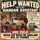 A distressed vintage-style metal sign advertising a 'Help Wanted Hangar Assistant' job. The sign features retro typography, a list of duties, and an illustration of two mechanics working on an airplane inside a hangar.