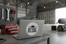 F-15 Eagle sticker on laptop in hangar