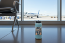 Jumpseat Therapy flight attendant sticker on a light blue water bottle at an airport terminal gate with an Airbus jet outside the window