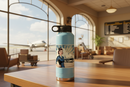 Regional Airline Vintage Flight Attendant sticker on a light blue water bottle in a vintage airport terminal with a classic propeller airliner outside the window