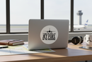 Jet fuel airline sticker on laptop in aviation workspace