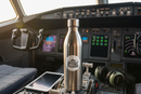 Jet fuel airline sticker on water bottle in cockpit