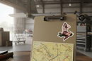 Pin Up Bomb Girl sticker on hard plastic clipboard with aviation charts