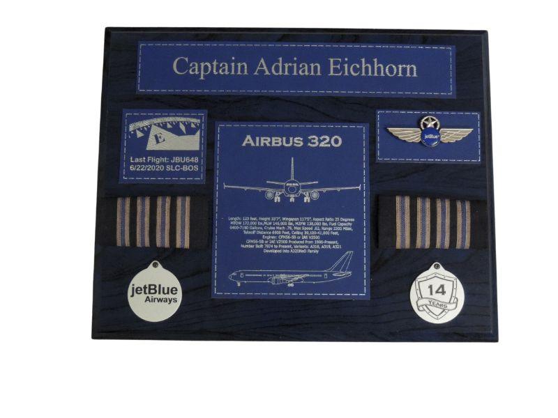 Black pilot retirement plaque with blue accents