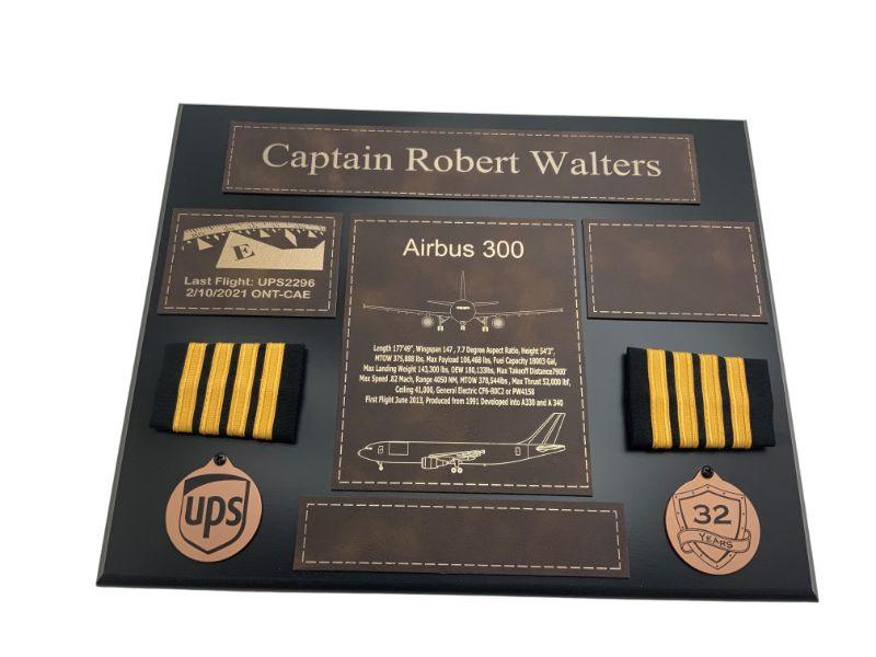 Black pilot retirement plaque with brown accents