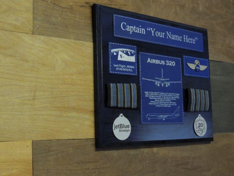 Black retirement plaque with blue accents